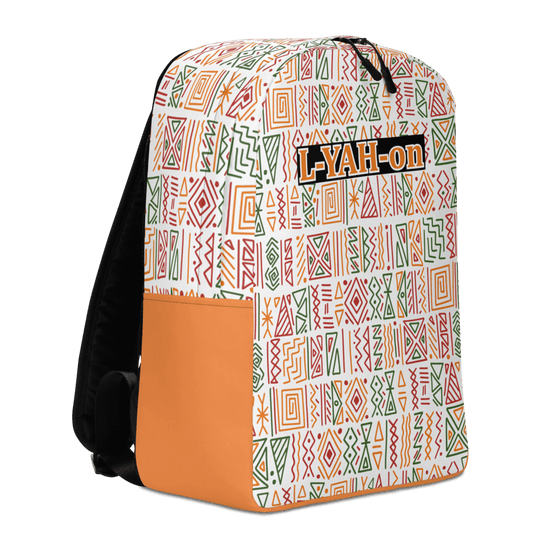 A minimalist backpack with an African print design, featuring a white background with geometric patterns