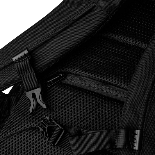 Close-up of a black backpack with mesh padding and zippers.