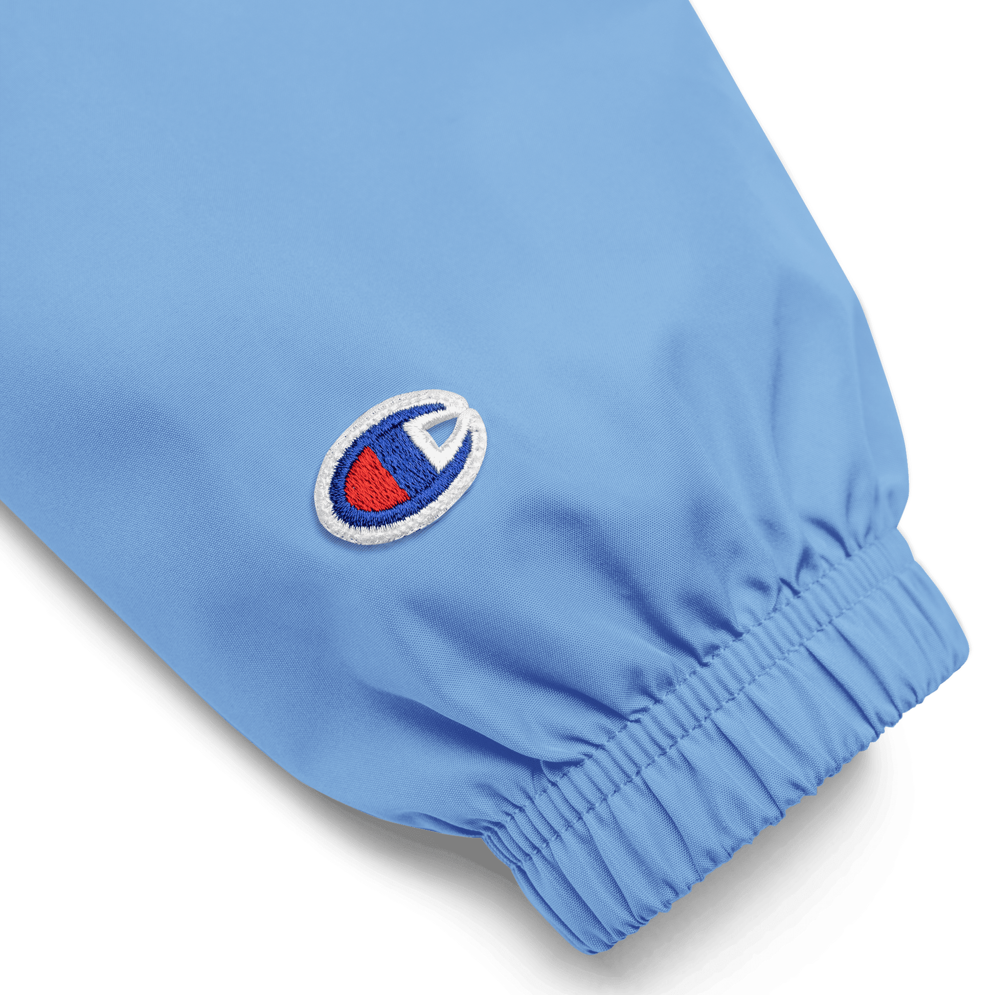 Close-up of a blue garment with a logo  - faith-based online store - windbreaker
