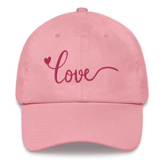 Pink cap with 'love' and a heart embroidered on it