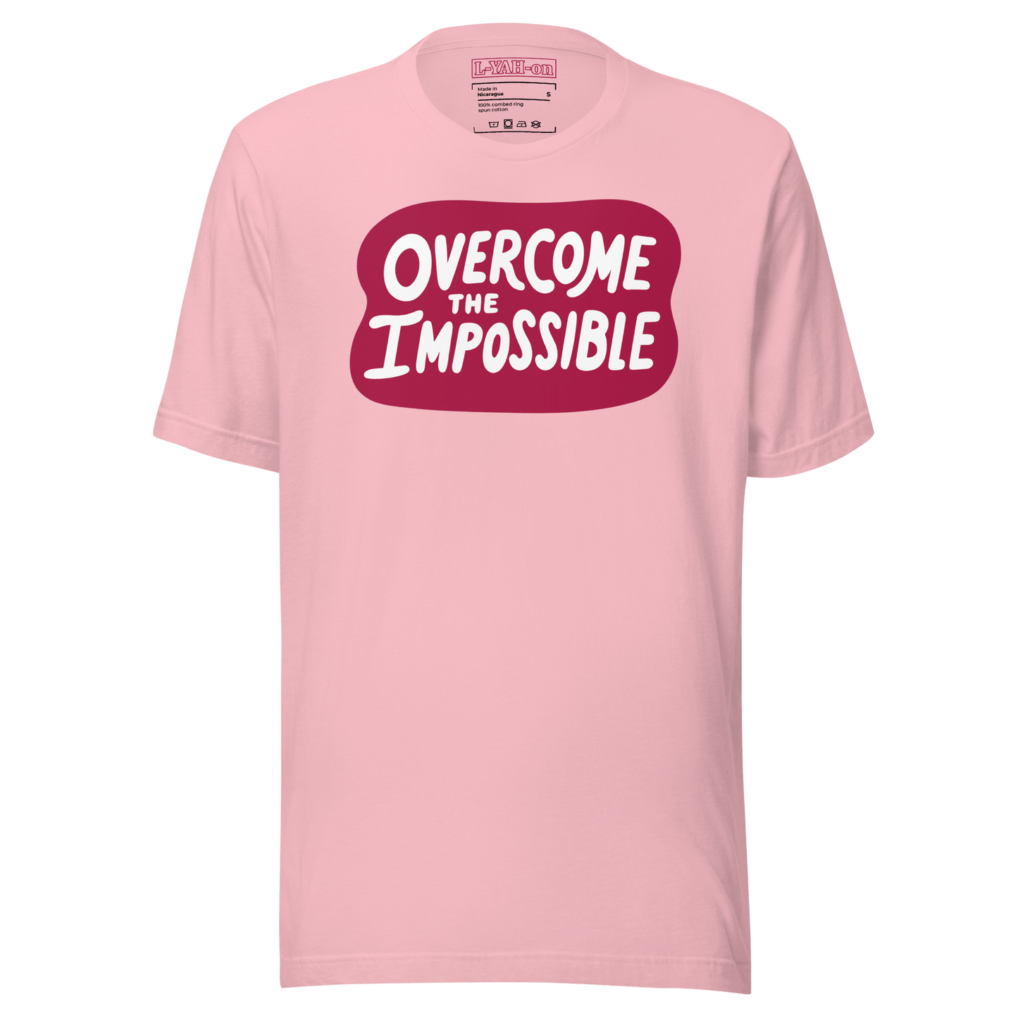 A pink t-shirt with the text 'overcome the IMPOSSIBLE' printed in a red graphic on the front.