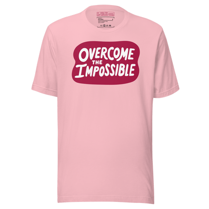 A pink t-shirt with the text 'overcome the IMPOSSIBLE' printed in a red graphic on the front.