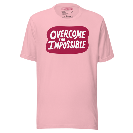 A pink t-shirt with the text 'overcome the IMPOSSIBLE' printed in a red graphic on the front.