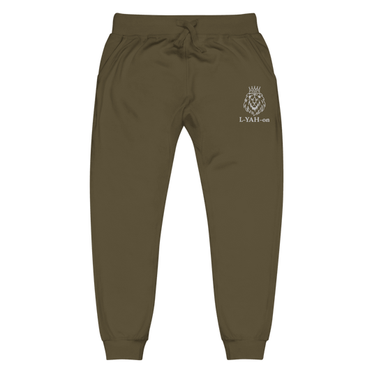 A pair of green sweatpants with a white embroidered logo on the left pocket area.