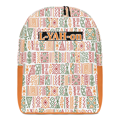 A minimalist backpack with an African print design, featuring a white background with geometric patterns