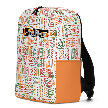 A minimalist backpack with an African print design, featuring a white background with geometric patterns