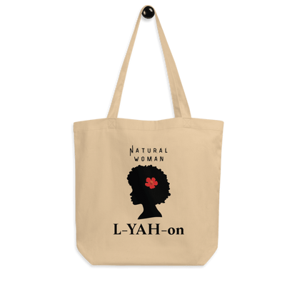 A beige organic cotton tote bag with a graphic print of a woman's silhouette and the brand name 'L-YAH-on'.