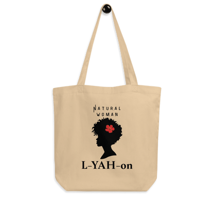 A beige organic cotton tote bag with a graphic print of a woman's silhouette and the brand name 'L-YAH-on'.