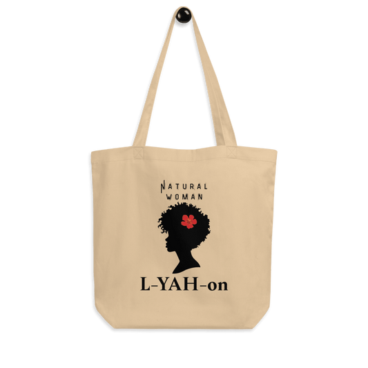 A beige organic cotton tote bag with a graphic print of a woman's silhouette and the brand name 'L-YAH-on'.