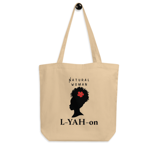 A beige organic cotton tote bag with a graphic print of a woman's silhouette and the brand name 'L-YAH-on'.