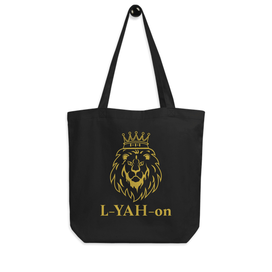 A black organic cotton tote bag with a golden printed lion's head and the brand name 'L-YAH-on' below it.