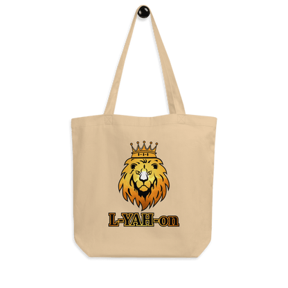 A black organic cotton tote bag with a graphic print of a lion's head wearing a crown and the brand name 'L-YAH-on' on the front.