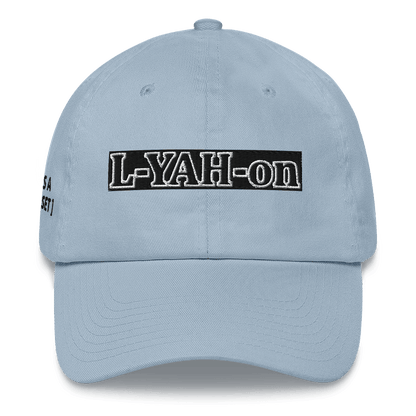 A white baseball cap with the text 'L-YAH-on' - classic dad hat - YHWH accessories