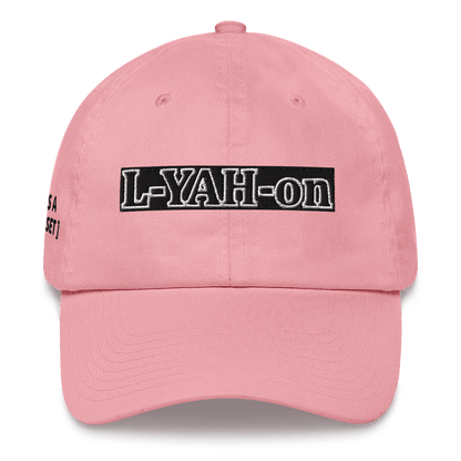 A white baseball cap with the text 'L-YAH-on' printed on the front.